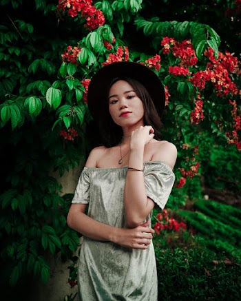 Photo of Woman Near Flowers