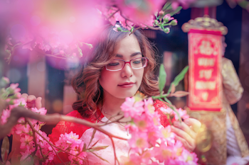 Photo of Woman Near Flowers