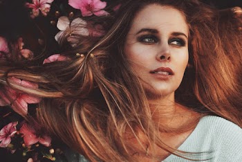 Photo of Woman Near Flowers