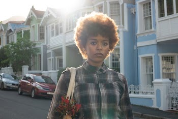 Photo Of Woman Near Houses