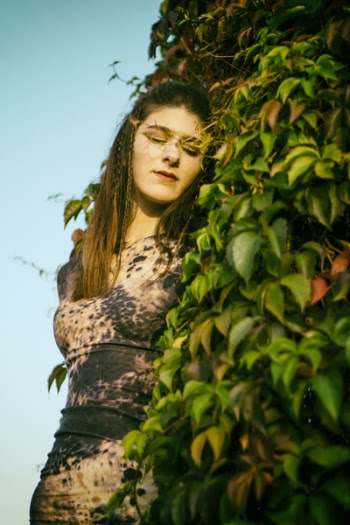 Photo of Woman Near Leaves