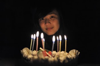 Photo of Woman Near Lighted Candles