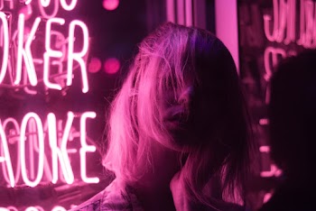 Photo of Woman Near Neon Lights