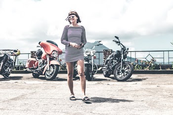 Photo of Woman Near Parked Motorcycles