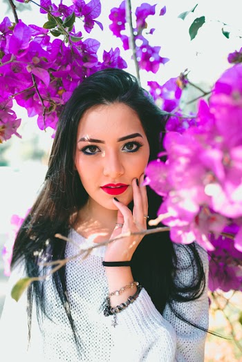 Photo of Woman Near Purple Flowers