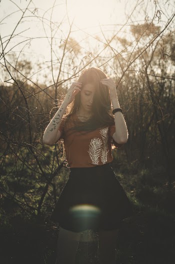 Photo Of Woman Near Tree Branches
