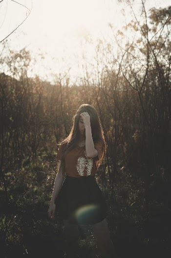 Photo Of Woman Near Tree Branches
