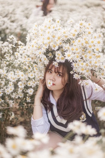 Photo of Woman Near White Flowers