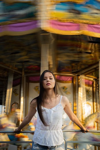 Photo Of Woman On Carousel  