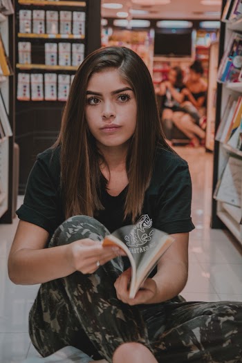 Photo of Woman Opening A Book