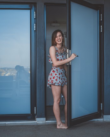 Photo of Woman Opening Door