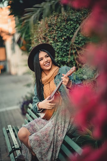 Photo Of Woman Playing Guitar