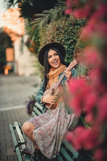 Photo Of Woman Playing Ukulele