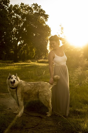 Photo of Woman Playing With Dog