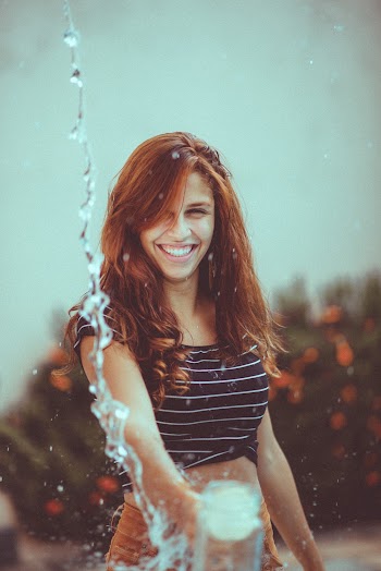Photo of Woman Playing With Water