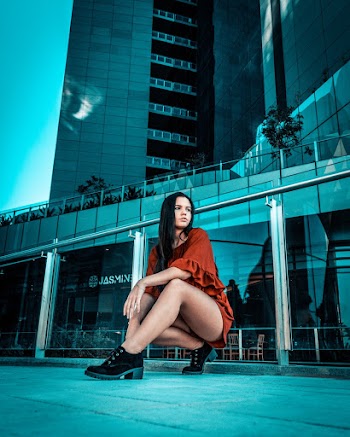 Photo of Woman Posing Near Handrail