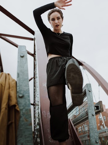 Photo of Woman Posing Near Railings