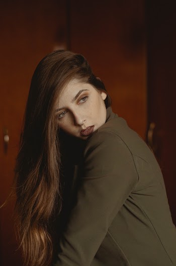 Photo of Woman Posing While Looking Away