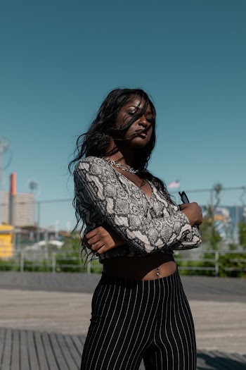 Photo of Woman Posing With Her Arms Crossed