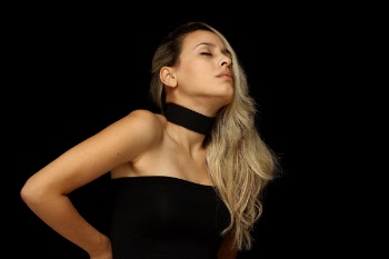 Photo of Woman Putting Her Hands on Her Back