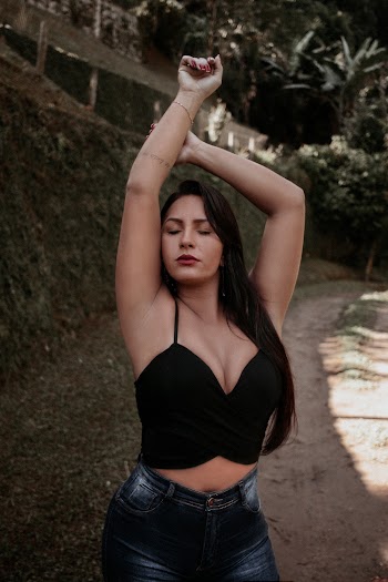 Photo of Woman Raising Her Both Arms