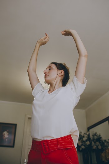 Photo of Woman Raising Her Both Hands
