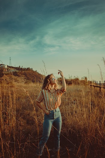 Photo of Woman Raising Her Hand