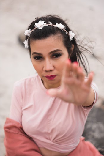 Photo of Woman Raising Her Left Hand