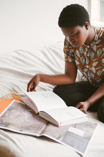 Photo Of Woman Reading Book