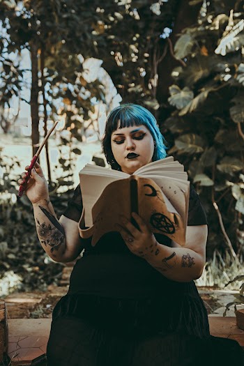 Photo of Woman Reading Book