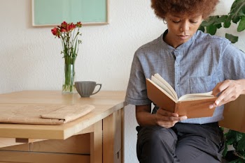 Photo Of Woman Reading Book