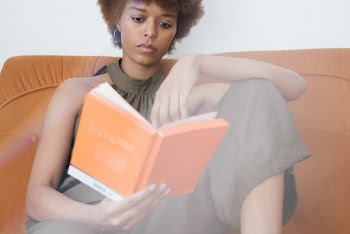 Photo Of Woman Reading Book