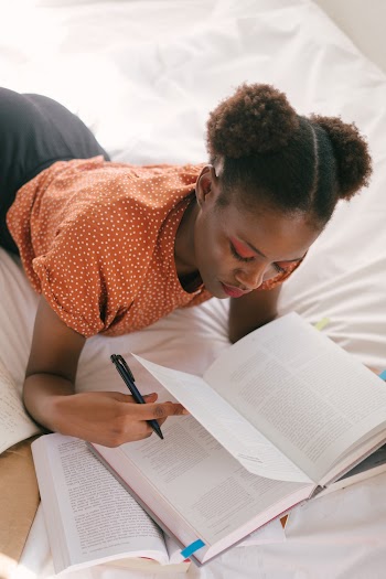 Photo Of Woman Reading Books