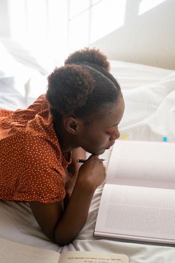 Photo Of Woman Reading Books
