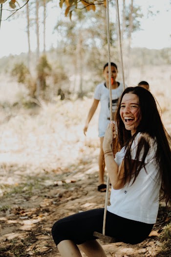 Photo Of Woman Riding Swing