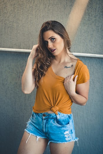 Photo of Woman Showing Her Tattoo