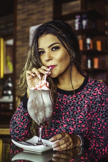 Photo Of Woman Sipping On Straw