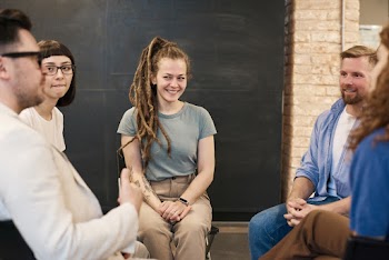 Photo Of Woman Sitting Beside Man 