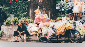Photo Of Woman Sitting Beside Motorcycle