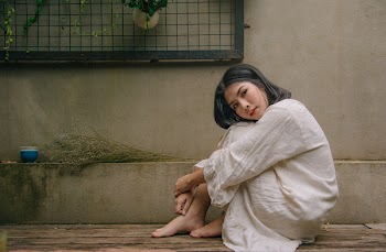 Photo of Woman Sitting Down on Floor