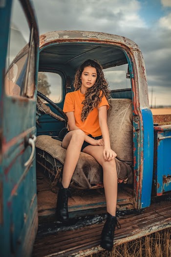 Photo Of Woman Sitting Inside Truck