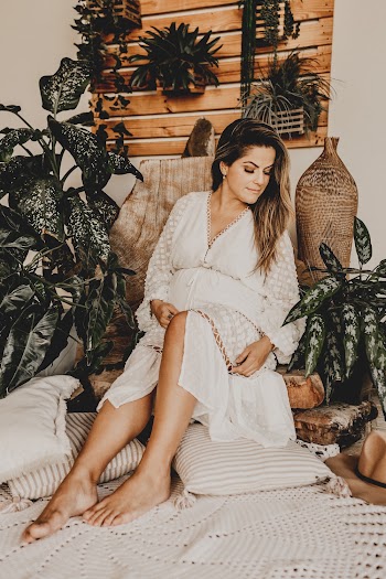 Photo Of Woman Sitting Near Plants