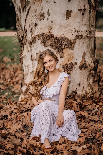 Photo of Woman Sitting Near Tree