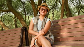 Photo of Woman Sitting On A Bench