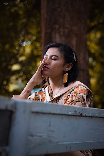 Photo Of Woman Sitting On A Bench