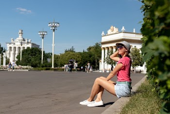 Photo Of Woman Sitting On A Gutter