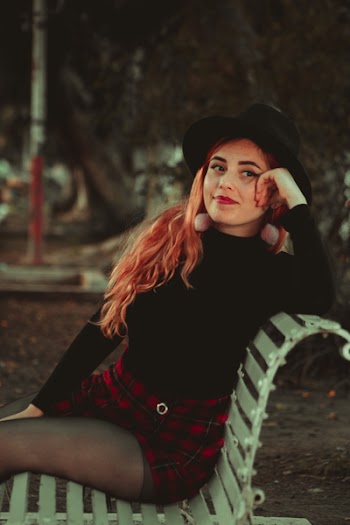 Photo Of Woman Sitting On Bench