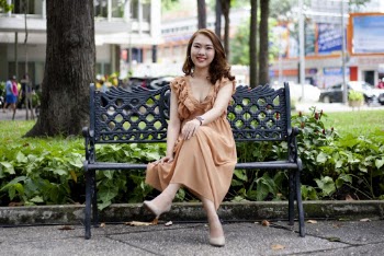 Photo of Woman Sitting on Bench