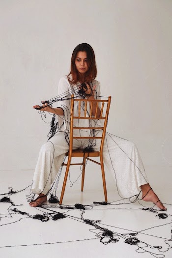 Photo Of Woman Sitting On Brown Chair