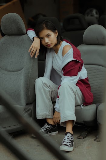 Photo Of Woman Sitting On Car Seat